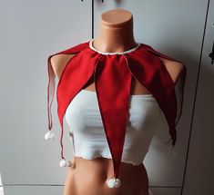 a female mannequin with a red scarf on it's head and neck