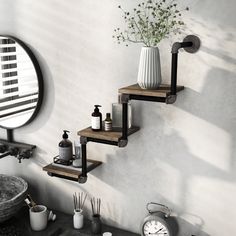 a bathroom with a sink, mirror and shelves on the wall next to each other