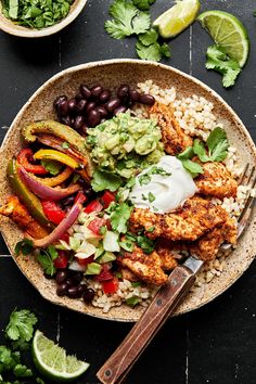 chicken fajita bowl with rice, black beans, avocado and cilantro