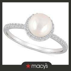 a white pearl and diamond ring with the words macy's on it