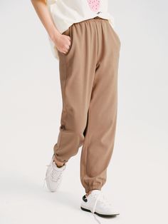 Details: Khaki color casual pants Made of high-count combed cotton, soft and comfortable to the touch Elastic waist, easy to put on and take off Customized embroidery, drawstring leg Materials & Care: Cotton 80.2%, Polyester 19.8% Hand wash | Dry clean Do not bleach Size & Fit: Model is 5'7", Bust 32, Waist 24, Hips 35, wearing a size S Item #: WM2PA07 Khaki Sweatpants With Pockets For Loungewear, Beige Athleisure Sweatpants With Elastic Waistband, Baggy Khaki Pants For Loungewear, Sporty Khaki Pants For Fall, Khaki Sweatpants With Pockets For Athleisure, Casual Khaki Sweatpants With Drawstring, Beige Athleisure Sweatpants For Spring, Beige Leisure Pants For Fall, Spring Beige Athleisure Sweatpants