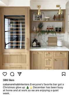 a kitchen with wooden cabinets and white marble counter tops is featured on the instagram page