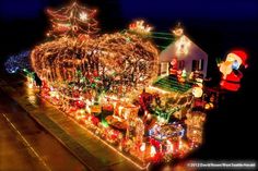 a house covered in christmas lights and decorations