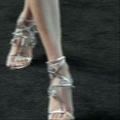 a woman's legs and shoes are shown in this artistic photo from the runway