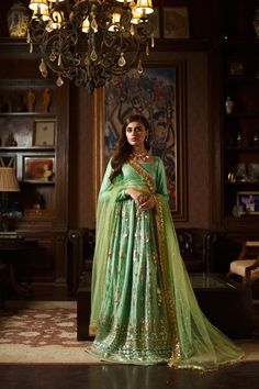 Green Lehenga Choli and Dupatta Pakistani Bridal Dress is a breathtaking attire to wear on the most important day of your life. This stunning Bridal Lehenga Choli is an epitome of elegance and it wins everyone's hearts at the very first glance. Lavish designs and embellishments give a glamorous touch to the Lehenga Choli. Tissue Dupatta, Green Lehenga Choli, Shimmer Blouse, Pakistani Bridal Dress, Indian Wedding Lehenga, Simple Lehenga, Bridal Dupatta, Green Lehenga, Pakistani Wedding Dress