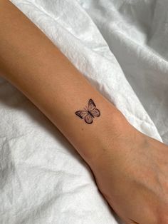 Butterfly tattoo on wrist Small Cute Butterfly Tattoos, Small Tattoos For Women Butterfly, Fine Line Tattoo Ideas Butterfly, Right Arm Tattoos For Women, Tatoos Small Butterfly, Tattoo The Butterfly, Small Butterfly Tattoo On Arm, Tiny Tattoos Butterfly, Buterfluffy Tatoos