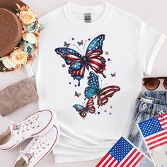 a t - shirt with an american flag butterfly on the front and stars in the back