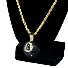 Men's iced black 8 ball hip hop chain. 14k yellow gold plated over alloy metal. 1 inch Eight Ball iced with dazzling stones. Chain measures 24" inches x 4 mm thick. Stylish & secure lobster claw clasp lock. Has a caged back for strong support. Solid weight to it at a 40 grams total. Shines so hard the stones will blind you. 100% FREE SHIPPING in USA. Order now! Eight Ball, Designer Jackets For Men, Hip Hop Chains, Designer Jackets, Gold Rope Chains, 8 Ball, Cz Necklace, Hip Hop Jewelry, Rope Chain