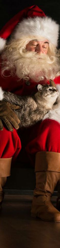 a man dressed as santa claus is dancing