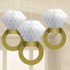 two white and gold rings hanging from the ceiling