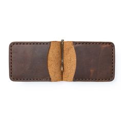 A Slim Leather Wallet that's Built for Cash and Cards. This wallet securely holds bills and cards while maintaining a slim profile, perfect for front-pocket carry. Quickly flip through your cash without having to remove your entire stack of bills. The solid brass spring bar clip ensures your money is secure and stays in your pocket.Our full-grain leather means your wallet will develop character and patina. We hand-sew this wallet with thick Tiger Thread so it will never unravel or come apart.The Leather Money Clip, Leather Money Clip Wallet, Leather Money Clips, Slim Leather Wallet, Horween Leather, Engraved Initials, Clip Wallet, Money Clip Wallet, Free Giveaway