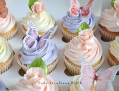 cupcakes with frosting and butterflies on them