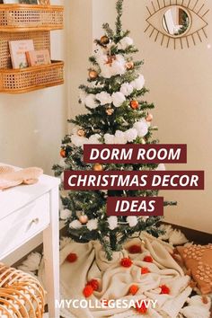 a small christmas tree in the corner of a room with white and gold decorations on it