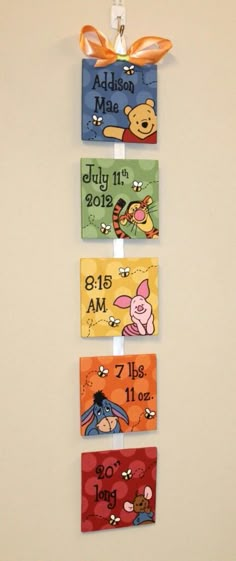 the winnie the pooh wall hangings are made out of wood and have four different colors