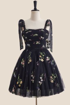 Enjoy your night out in this playful black floral dress. With an A-line silhouette and corset bodice, this dress is sure to hug your curves in all the right places. The tie shoulders and lace-up back add both style and comfort, allowing you to dance the night away. Plus, with built-in bra for support and above knee length, this dress is both flattering and easy to wear. 

SKU: OM1148
Tulle material 

Black color

A-line silhouette
Corset bodice with tie shoulder and floral

Ruched details
Built- Fitted A-line Corset Dress With Lace-up Back, Black A-line Dress With Corset Back, Spring A-line Corset Dress For Prom, Black Lace-up Back Prom Dress, Black Prom Dress With Lace-up Back, Summer Homecoming Corset Dress With Fitted Bodice, Black Dress With Fitted Bodice For Homecoming, Black Homecoming Dress With Fitted Bodice, Floral Print Mini Corset Dress For Party