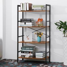 a bookshelf filled with lots of books next to a potted plant