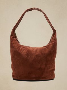 Part hobo bag, part tote bag, this carryall is crafted in soft suede for a slouchy, relaxed look that's also luxurious.  Zip top closure.  External zip pocket.  Internal pocket.  Fully lined.  Height: 10. 8" (27. 5cm) Width: 20" (50cm) Depth: 6" (15c Big Bucket, Slouchy Tote, Suede Tote Bag, Slouchy Bag, Autumn Trends, Travel Necessities, Suede Tote, Bucket Bags, Fancy Bags