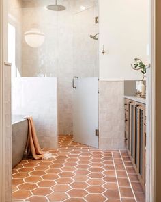 the instagram page shows an image of a bathroom with tile flooring and walls