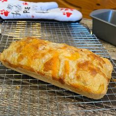 a loaf of bread sitting on top of a cooling rack