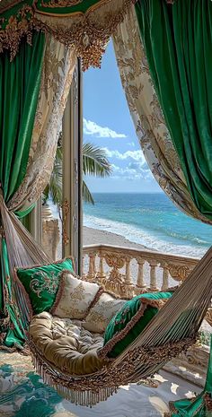 a hammock hanging in front of a window overlooking the ocean