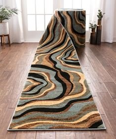 a long rug on the floor in front of a window