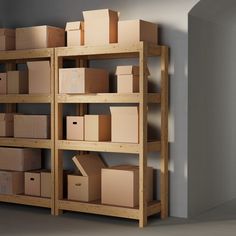 boxes are stacked on wooden shelves in an empty room