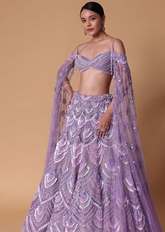 Lavender Pearl Embellished Lehenga with Off-Shoulder Draped Cape Engagement Outfits Indian, Off Shoulder Cape, Off Shoulder Lehenga, Botas Outfit, Suits For Women Indian, Wisteria Purple, Purple Lehenga, Chic Prom Dresses, Trendy Outfits Indian