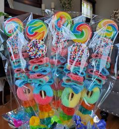 candy lollipops are in plastic bags on a table