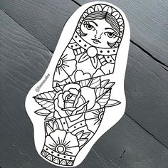 a sticker with an image of a woman's hand and flowers on it