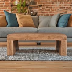 a wooden table sitting in front of a couch