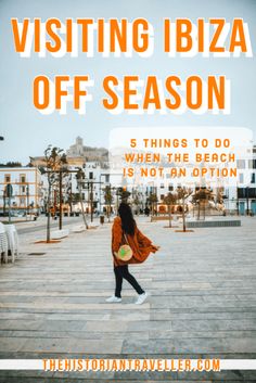 a woman walking down the street with text overlay saying visiting ibza off season 5 things to do when the beach is not an option