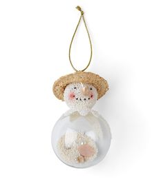 an ornament shaped like a snowman in a straw hat