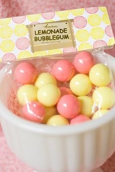 lemonade bubblegum candy in a white bowl on a pink tablecloth with a yellow label