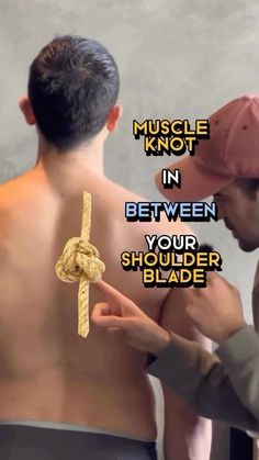 a man with no shirt on is tying a rope to another mans back that has the words muscle knot in between his shoulders