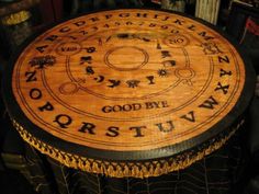 a wooden table with writing on it