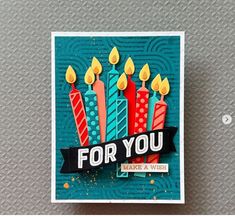 a birthday card with candles on it