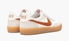 The Nike Killshot 2 “Desert Orange” is another clean, vintage-inspired colorway of the low-top tennis shoe.  The Killshot 2 originally debuted in the 1970s as a performance court shoe before transitioning into the lifestyle category in recent years.  The model’s timeless look, easy to wear colorways, and even its collaborations with J.  Crew have helped put it on the radar of stylish people worldwide.  This “Desert Orange” colorway features a white leather base with contrasting grey suede overla Vintage Nike Low-top Custom Sneakers, Nike Retro Skate Shoes With Contrast Sole, Vintage Skate Shoes With Speckled Midsole For Sports, Retro Nike Custom Sneakers With Contrast Sole, Vintage Nike Low-top Skate Shoes, Vintage Nike Leather Skate Shoes, Nike Retro Low-top Skate Shoes, Nike Retro Skate Shoes With Gum Sole, Retro Nike Skate Shoes With Gum Sole