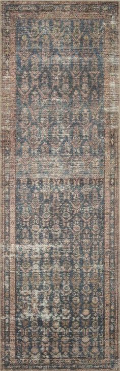 an antique rug with blue, red and beige colors on the bottom half of it