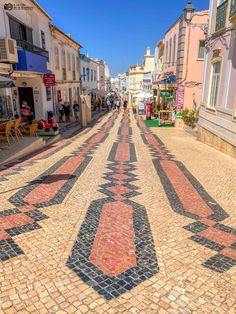 the street is lined with colorful mosaic tiles