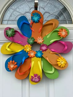 **The dark orange is out of stock as its been delayed. If you have a preference on another color please message me Get your front door ready to impress all of your guests with the footwear we love to wear. This colorful wreath is sure to be the perfect addition to your indoor or outdoor spring/summer decorations. Made with flip flops fastened with greening pins making it sturdy and heat resistant. This Summer wreath measures approximately 19-21" in diameter, includes 12 youth flip flops and come Beach House Front Door, Summer Flip Flop Wreath, Couronne Diy, Flip Flop Wreath, Summer Front Door, Spring Porch Decor, Flip Flop Wreaths, Fun Wreath, Colorful Wreath