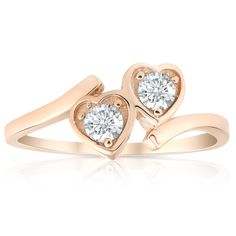 two hearts shaped diamond ring in rose gold with diamonds on each side and the center stone is