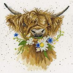 a cross stitch pattern of a brown cow with flowers in its mouth, on a white background