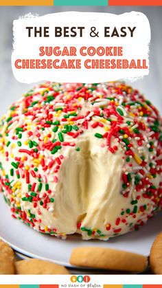 the best and easy sugar cookie cheesecake ball is on a white plate with sprinkles