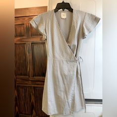 Super Cute Women’s Wrap Dress, Ties At Waist. Gray With White Pin Stripes. Ruffle Sleeves, Size Xs, New Condition. Shoulder: 13” Flat Measurements Overall Length: 33” Flat Measurements. Smoke Free Home, Never Worn. Offers Encouraged :) Casual Cotton V-neck Wrap Dress, Summer Wrap Dress With Flutter Sleeves For Brunch, Summer Brunch Wrap Dress With Flutter Sleeves, Spring Wrap Dress With Flutter Sleeves For Brunch, Spring Flutter Sleeve Wrap Dress For Brunch, Spring Brunch Wrap Dress With Flutter Sleeves, Summer Dress With Tie Waist And Flutter Sleeves, Summer Dresses With Tie Waist And Flutter Sleeves, Casual Wrap Dress For Spring Daywear