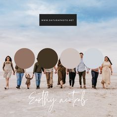 a group of people walking across a sandy beach with circles in the shape of speech bubbles