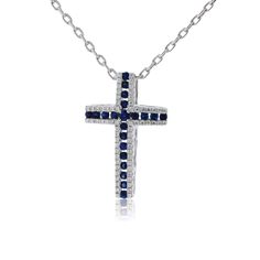 18K White Gold .24ctw Diamond & .48ctw Sapphire Cross Pendant w/Chain Show your faith and spiritual devotion as you wear this sapphire and diamond cross pendant. Glistening demi-pave set round diamonds enhance the beauty and brilliantly deepen the spiritual meaning of this diamond cross. Sapphires with a deep blue hue are set at the center for a bold look. This cross will be cherished as it is passed down through many generations. Product Details Pendant Information Center Gemstone Accent St Luxury Blue Cross-shaped Jewelry, Aquamarine Studs, Interlocking Ring, Rainbow Sapphires, Diamond Jewelry Necklace, Information Center, Diamond Cross Pendants, Spiritual Meaning, Diamond Cross