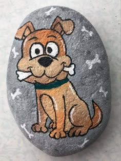 a painted rock with a dog on it