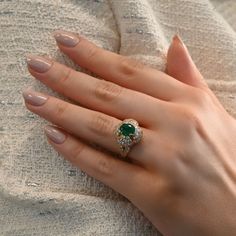 The ultimate statement piece for your special occasions - this yellow gold vintage cocktail ring features a luscious 1.25 carat green emerald, surrounded by 78 brilliant diamonds. Available in 18K Yellow Gold Available in a size 6 Ring can be resized between sizes 5-7 for an additional fee. Please contact our team at info@stephaniegottlieb.com for more information. Green Emerald weight = 1.25 carats Diamond weight = 2.58 carats Diamond quality = FG color, VS clarity Origin = Germany Estimated fr Vintage Cocktail Ring, Diamond Cocktail Ring, Late 1960s, Diamond Cocktail Rings, Vintage Cocktail, Band Bracelet, Diamond Shop, Bracelet Collection, Green Emerald