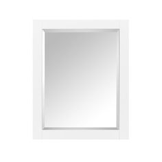 a white framed mirror on a wall