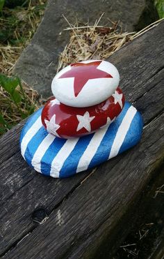 two red white and blue rocks stacked on top of each other